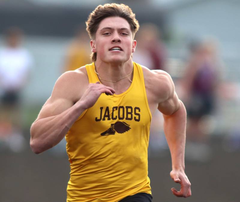 Jacobs’ Matt Scardina competes in the 100-meter dash during the McHenry County Track and Field Meet at McCracken Field on Thursday, April 24, 2025, in McHenry