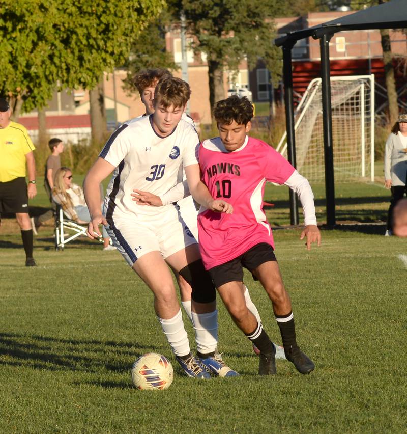 Oregon's Eduardo Munoz Garcia (10) and Faith Christian's Brody Bodzioch (30) fight for position during a Thursday, Oct. 9, 2025 game at Oregon Park West.
