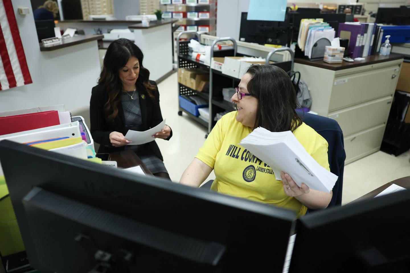 Lauren Staley-Ferry looks over her paperwork as she files a petition to get on the ballot for re-election as Will County Clerk in the 2022 primary election at the Will County Office Building. Monday, Mar. 8, 2022, in Joliet.