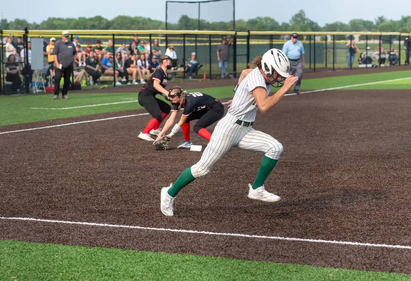 St. Bede's Lily Bosnich tries to beat out a bunt in Friday's sectional softball championship game in Chillicothe.