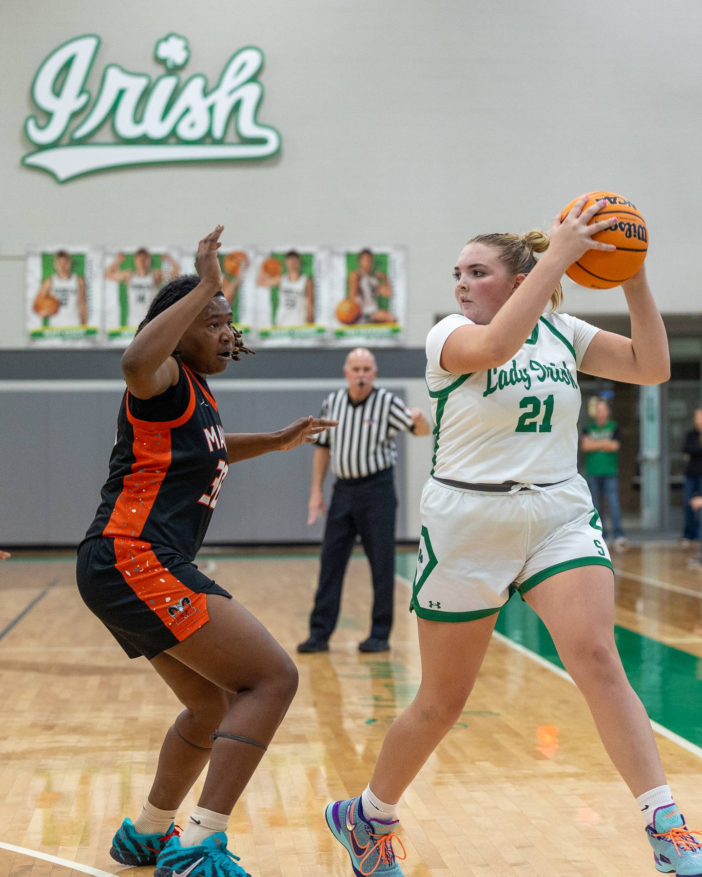 Camryn Stecken (21) of Seneca looks for pass as Nyanna Payton (30) of Peoria Manual guards in championship game against Peoria Manual on Saturday, November 22, 2025 at Seneca High School in Seneca.