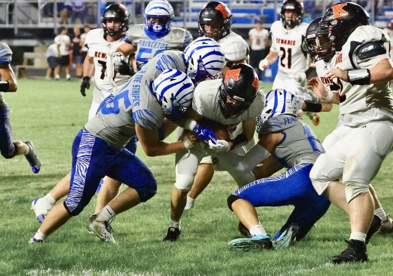 Three Tigers team up to tackle a Kewanee ball carrier Friday night at Bryant Field. The Tigers won 63-12.
