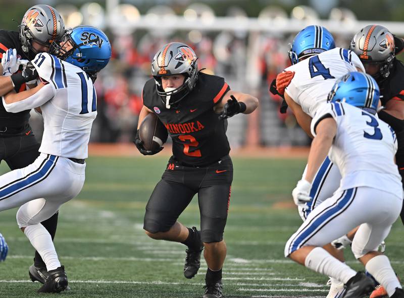 Minooka's Chase Nurczyk (2) rushes the ball during the non-conference game against St. Charles North on Friday, August. 29, 2025, at Minooka.