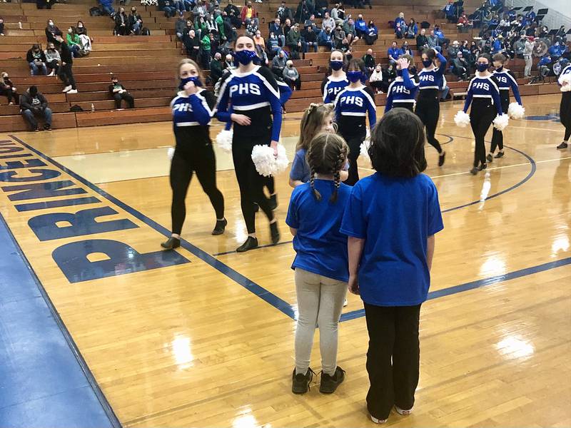 Some young admirers watched the Princeton High poms perform during Saturday night's basketball game. A little cheerleaders' clinic performed between games.
