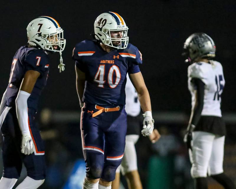 Oswego senior linebacker Conor Tully (40) looks to the sidelines during a 2025 game with Oswego East.