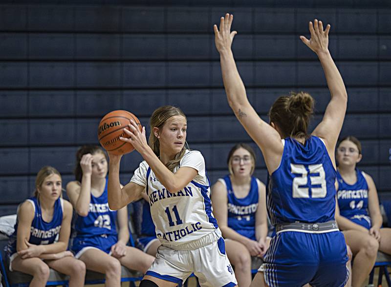 Newman’s Brooklyn Smith looks to pass against Princeton’s Miyah Fox Thursday, Dec. 14, 2023 at Newman High School.