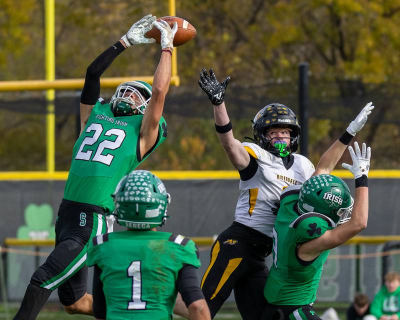 Brayden Simek (22) of Seneca attempts to intercept pass as Caen Beckett (1) of Riverdale looks to catch on Saturday, November 1, 2025 at Seneca High School in Seneca.