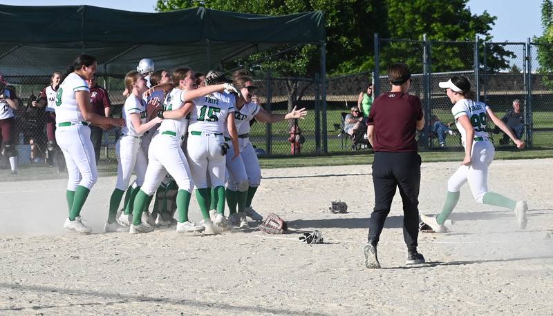 Rock Falls right fielder Maddie Morgan runs to the celebration with her teammates after the Rockets won the Class 2A Stillman Valley Sectional championship Friday.