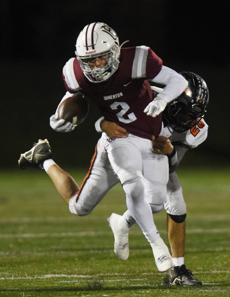 Joe Lewnard/jlewnard@dailyherald.com
Wheaton Academy’s Brandon Kiebles gets tackled by Sandwich’s Diego Gomez during the Class 4A quarterfinal game in West Chicago Friday.