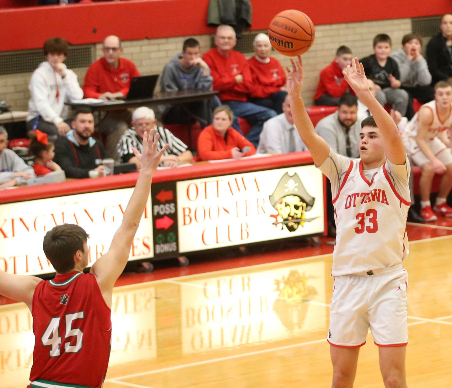 Ottawa's Cooper Knoll shoots a jump shot over L-P's Brendan Boudreau in Kingman Gymnasium on Friday, Feb. 10, 2023 at Ottawa High School.