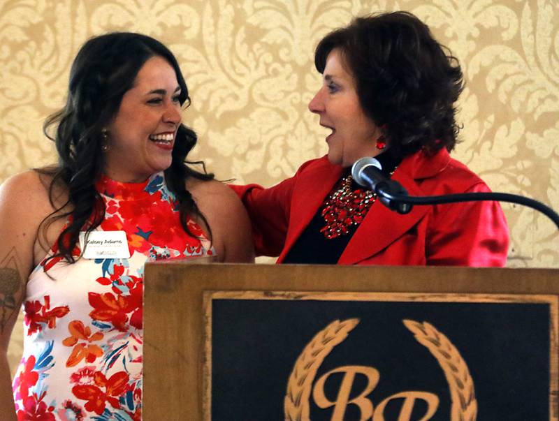 Award recipient Kelsey Adams is greeted by  Kathleen Caldwell, of Caldwell Consulting Group, before Adams speaks during the Northwest Herald's Women of Distinction award luncheon Wednesday June 7, 2023, at Boulder Ridge Country Club, in Lake in the Hills. The luncheon recognized 10 women in the community as Women of Distinction.