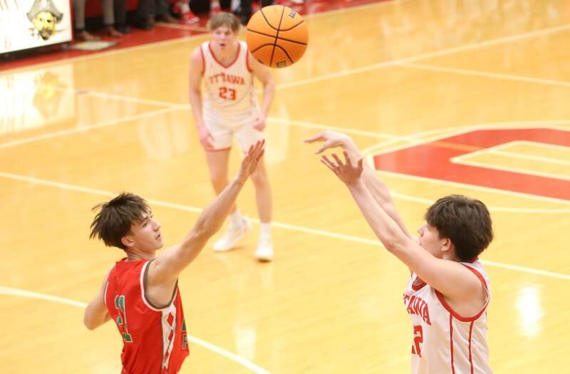 Ottawa's Dom Parks drains a three point shot against L-P's Wyatt Kilday on Friday, Jan. 10, 2024 in Kingman Gym at Ottawa High School.