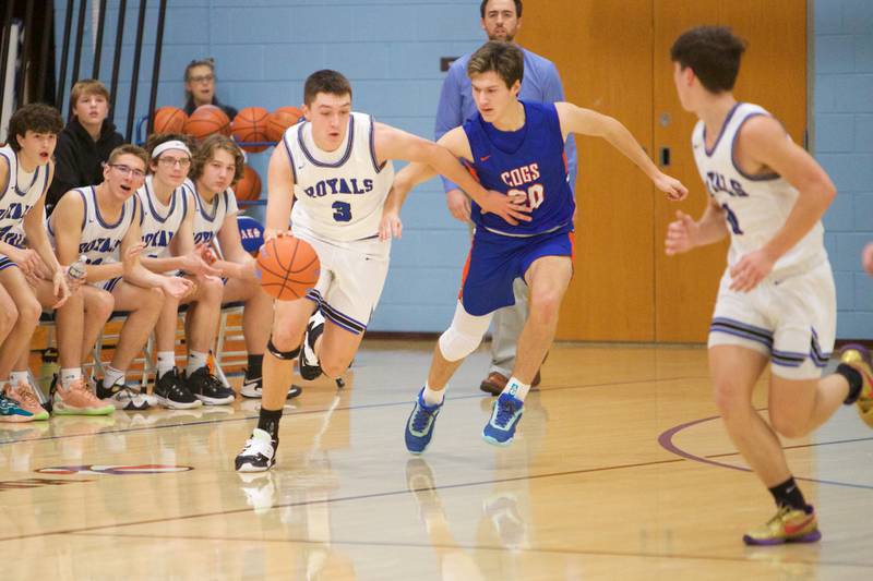 Hinckley - Big Rock's Ben Hintzsche looks for a break away past Genoa Kingston's Nathan Skarzynski on Thursday, Dec. 8, 2022 in Hinckley.