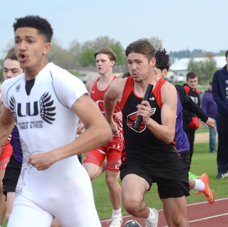 Forreston's Noah Dewey chases Lena-Winslow's Jaylen Rakowska in the final leg of the 4x100 relay at the Hall of Fame Hawk Classic on Friday, May 2, 2025 at Landers-Loomis Field in Oregon.