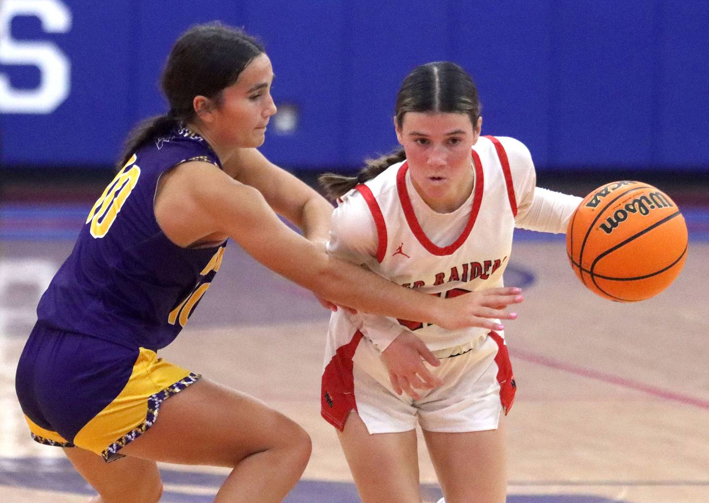 Huntley’s Aubrina Adamik moves the ball against Hononegah in girls basketball at Dundee-Crown High School in Carpentersville on Tuesday, November 25, 2025.