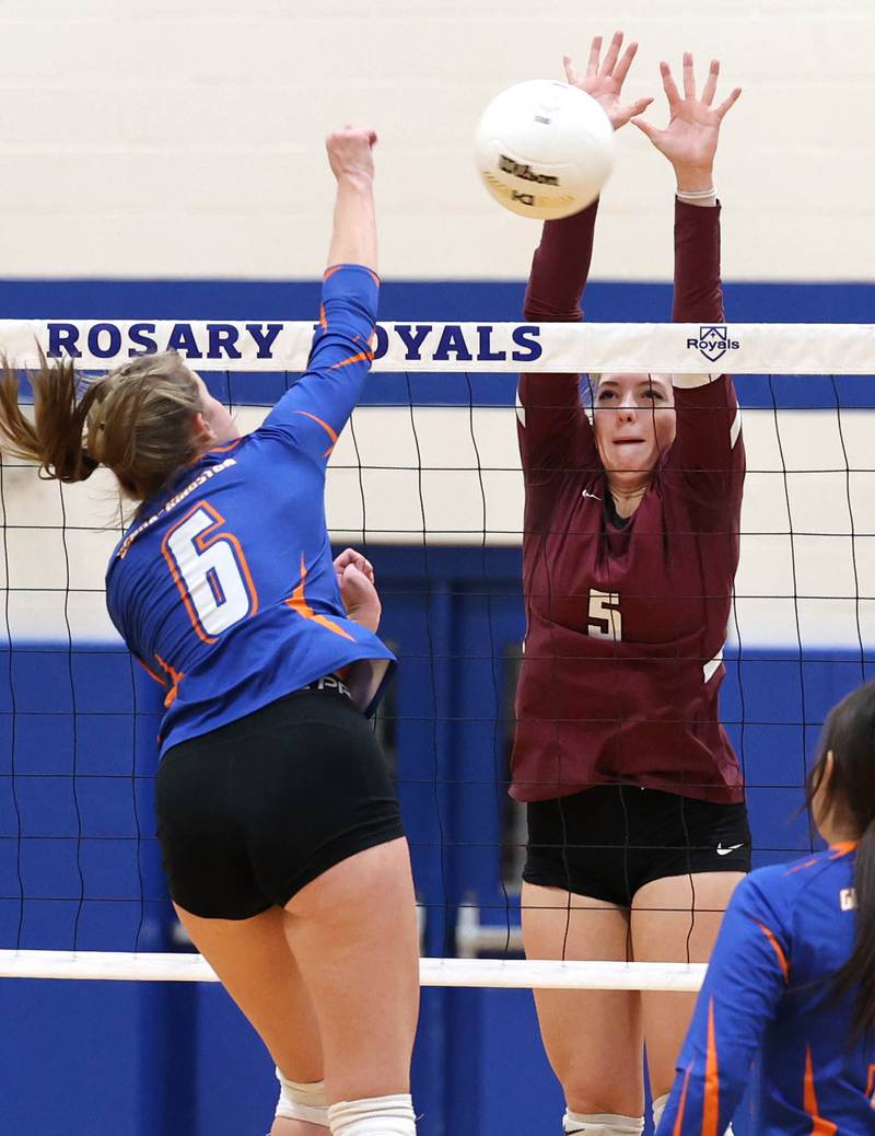 Marengo's Gianna Almeida blocks Genoa-Kingston's Kaitlin Rahn Thursday, Oct. 27, 2022, during their Class 2A Regional final match at Rosary High School in Aurora.