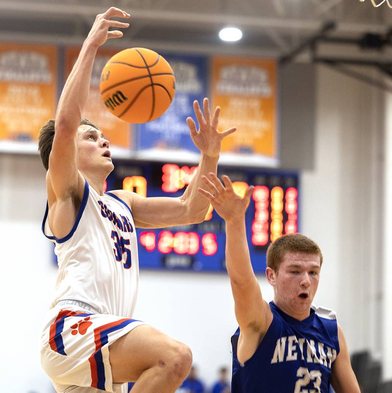 Eastland’s Parker Krogman has the ball knocked away by Newman’s John Rowzee Tuesday, Dec. 10, 2024, at Eastland High School.