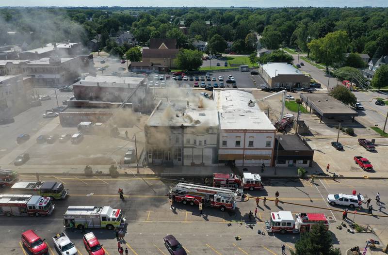 Smoke pours out of an apartment fire in the 800 block of Main Street on Monday, Aug. 22, 2022 in Mendota.