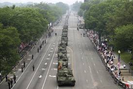 Military parade rolls through DC as ‘No Kings’ protesters across US decry Trump