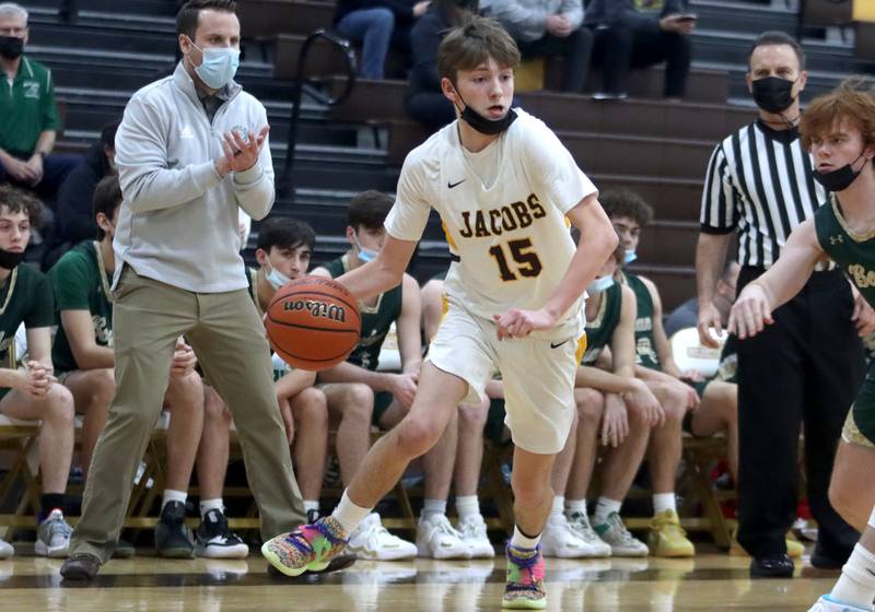 Jacobs’ Carter Roper moves with the ball during boys varsity basketball against Rockford Boylan at Algonquin Saturday afternoon.