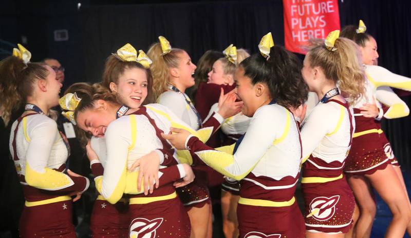 Members of the Richmond-Burton cheerleading team react after winning runner-up in the small team Competitive Cheerleading State Final Competition on Saturday, Feb. 3, 2024 at Grossinger Motors Arena in Bloomington.