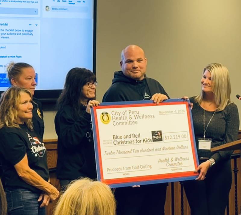 Peru’s Health and Wellness Committee raised a record $12,219 during its fifth annual charity golf outing to support Blue & Red Christmas for Kids.