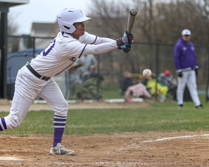 Plano's Amari Bryant (10) attempts a bunt during baseball game between Sandwich at Plano on Thursday, April 9, 2025 in Plano.