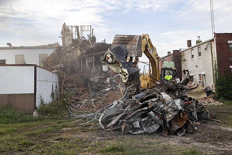 Patrick Burke of Burke Excavating begins the demolition of Tuesday, Sept. 5, 2023 of a downtown Sterling apartment building destroyed in a July 7 fire.