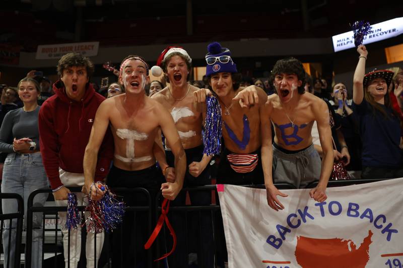IC Catholic get excited during player introductions before the game against Genoa-Kingston in the Class 2A championship match on Saturday in Normal.