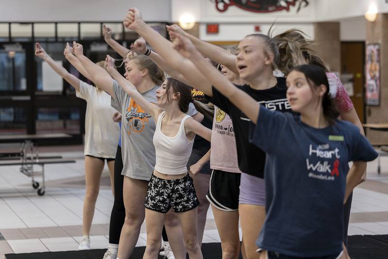 The Erie-Prophetstown competitive cheer squad runs through a practice routine on Wednesday, Jan. 18, 2023 at Erie High School. The team will perform a variety of stunts backed by musical numbers. during the IHSA sectional on Saturday.