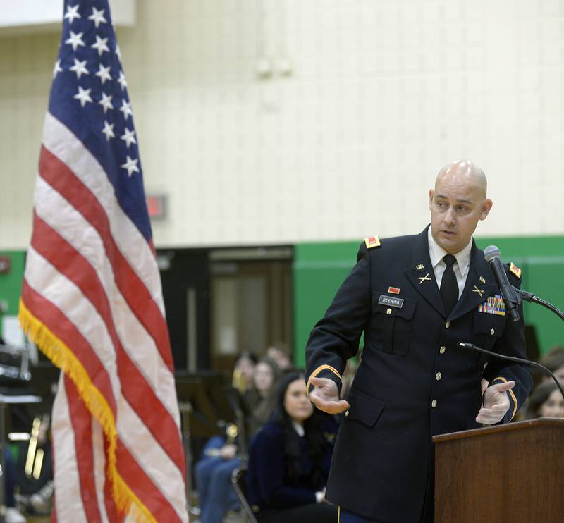 Guest speaker Jonathon Deering of the Illinois National Guard, gives a talk on what it means to be a veteran Friday during an all school assembly at Seneca High School.  The Seneca FFA led the program to honor veterans.