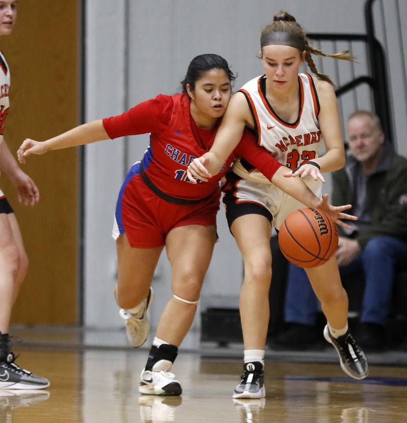 Dundee-Crown’s Monica Sierzputowski tries to steal the ball from McHenry's Ali Ahrens during a Fox Valley Conference girls basketball game on Tuesday, Dec. 12, 2023, at McHenry High School.