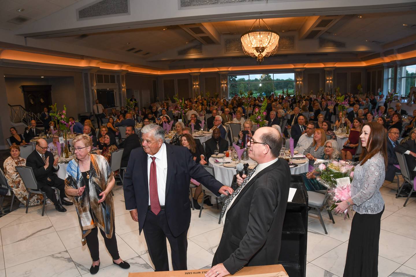 Trinity Services in New Lenox honored current board chairman Raymond D. McShane (center) for 50 years of service at its 33rd annual “Better Together” dinner dance on Saturday, Sept. 24, 2022, at The Odyssey in Tinley Park. Ray is pictured with his wife Linda McShane (left) and Thane A. Dykstra (right), Trinity Services president and CEO.