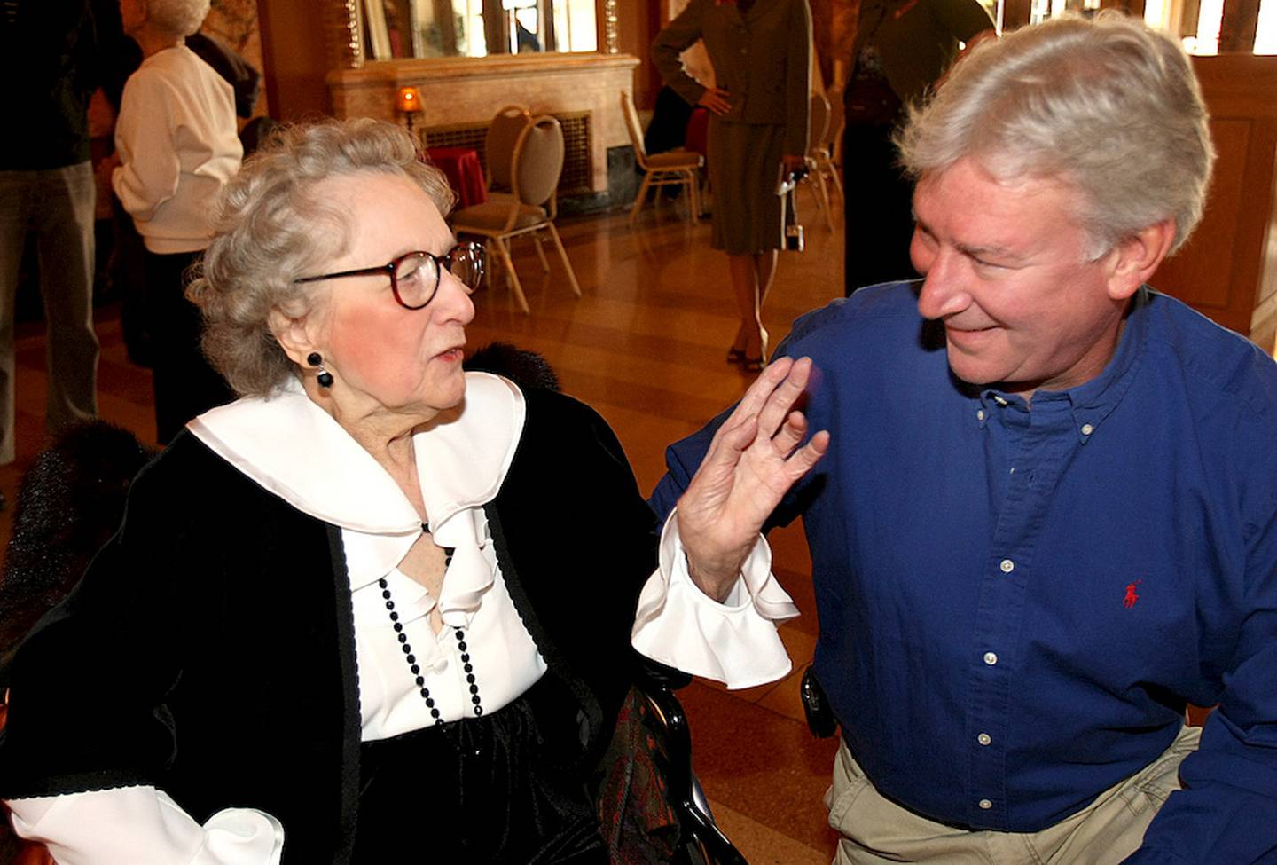Dorothy Mavrich talks in November 2008 to Steve Rubens, the grandson of Claude Rubens, one of the six brothers who built the Rialto Square Theatre. Mavrich, the woman credited with leading a grassroots effort to save the Rialto Square Theatre from demolition, died Tuesday afternoon at age 94.