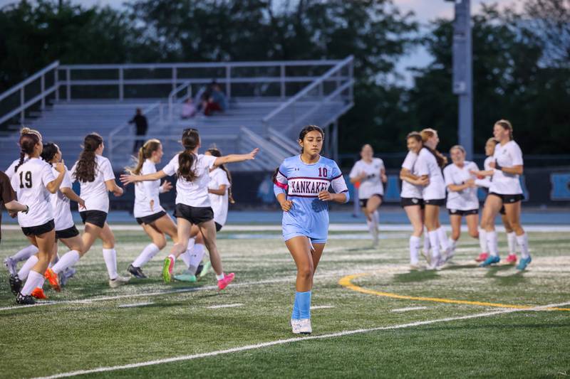 Kankakee's Regina Vazquez-Vargas leaves the pitch as Oak Forest celebrates their 3-1 win over the Kays in the IHSA Class 2A Kankakee Regional championship on Friday, May 23, 2025.