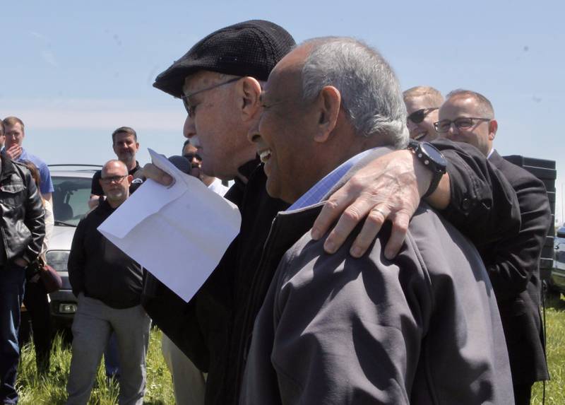 Hotel developer Al Hill embraces partner Magan Patel during remarks on Wednesday, May 3, 2023, prior to a groundbreaking for a Tru by Hilton near South Galena Avenue in Dixon.