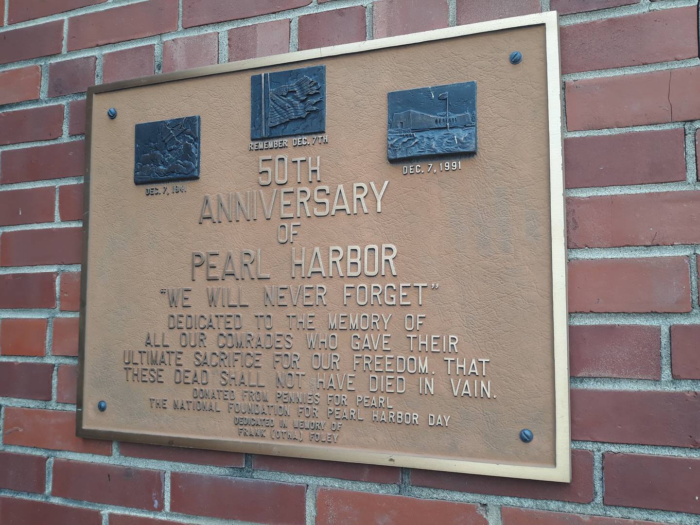 A plaque outside of the Ottawa VFW serves as a reminder of those who lost their lives during the attack on Pearl Harbor, Dec. 7, 1941.