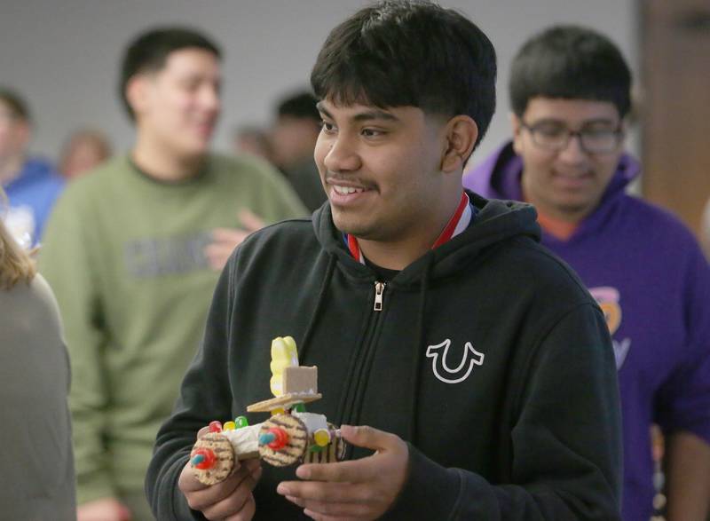Osvaldo Morales holds his edible car while waiting his turn to race it during the 29th annual Edible Car Contest on Wednesday, Feb. 26, 2025 in the cafeteria at Illinois Valley Community College.