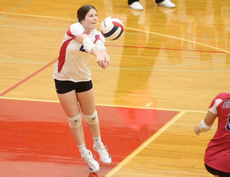 Princeton's Caroline Keutzer (top left) blocks a spike from Hall's Natalia Zamora (right) on Thursday, Oct. 9, 2025 at Hall High School.