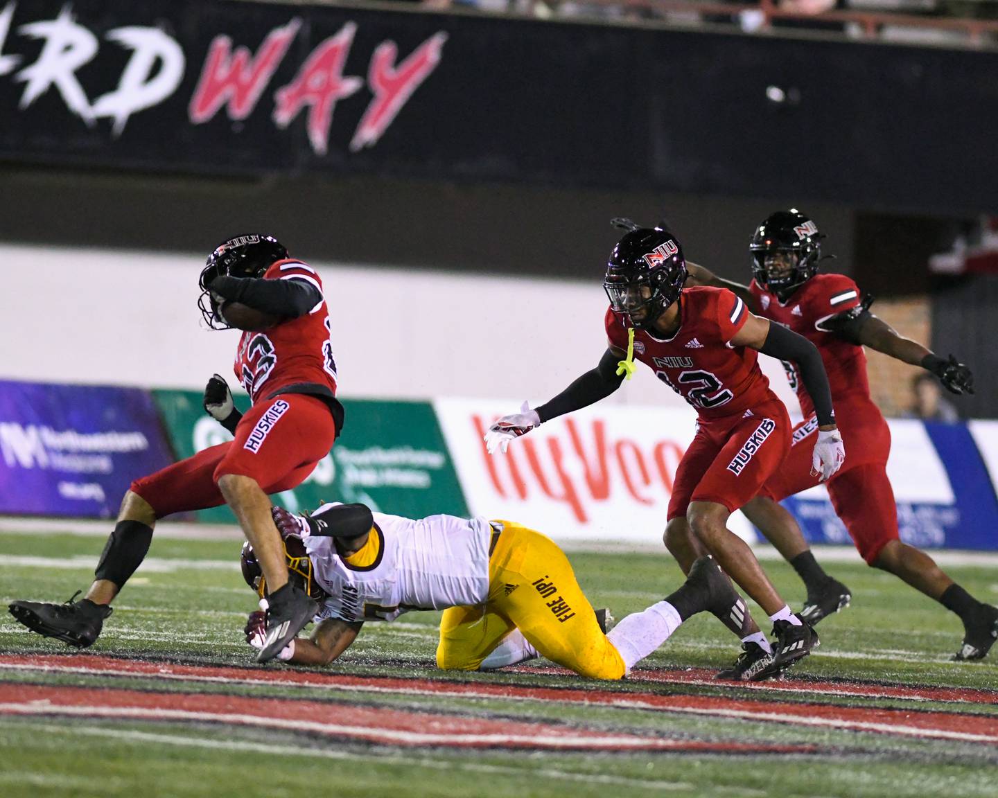 NIU Jordan White, left, is brought down by a Central Michigan in the first quarter after Jordan intercepted the ball on Wednesday Nov. 2nd at Huskie Stadium in DeKalb.NIU Jordan White is brought down by a Central Michigan in the first quarter after Jordan intercepted the ball on Wednesday Nov. 2nd at Huskie Stadium in DeKalb.