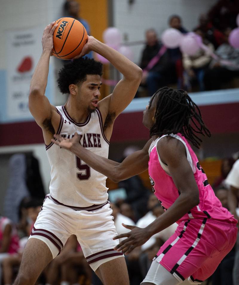 Kankakee's EJ Hazelett looks for an opening as Rich Township's Dyron Watson guards in a game on Friday, February 6, 2026.