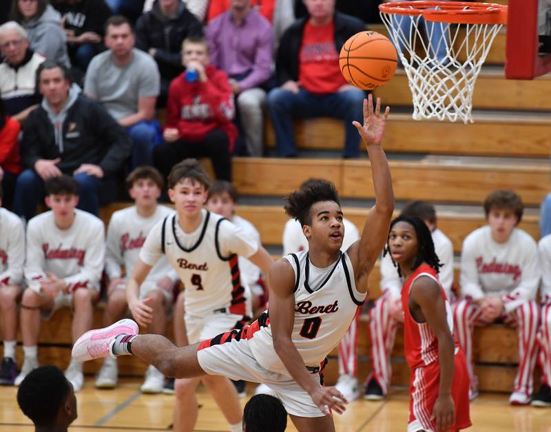 Benet’s Blake Fagbemi (0) lays the ball up during a game against Marist on Friday, Dec. 13, 2024 at Benet Academy in Lisle.