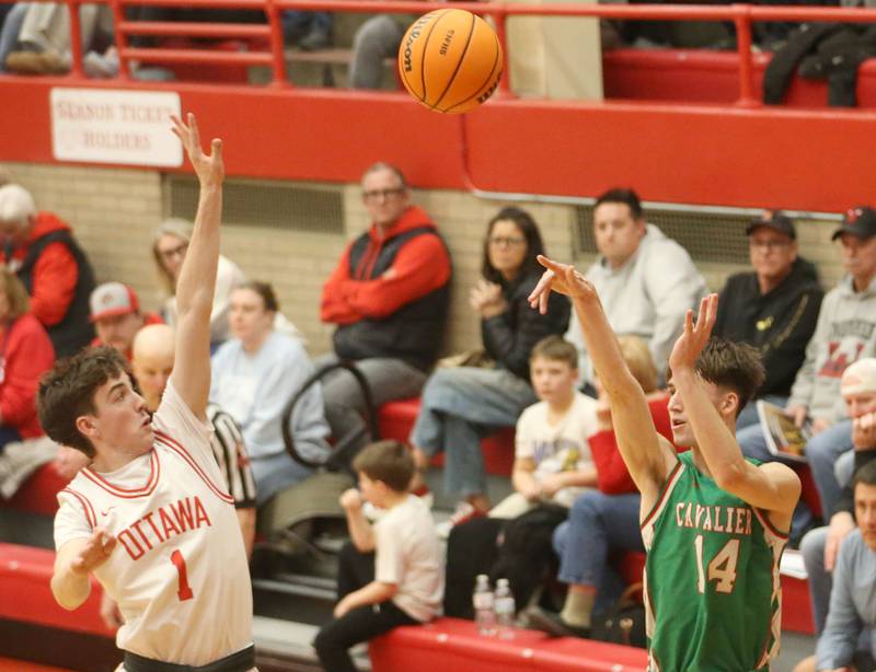 L-P's Wyatt Kilday lets go of a jump shot over Ottawa's Colt Bryson on Friday, Feb. 6, 2026 in Kingman Gymnasium at Ottawa High School.