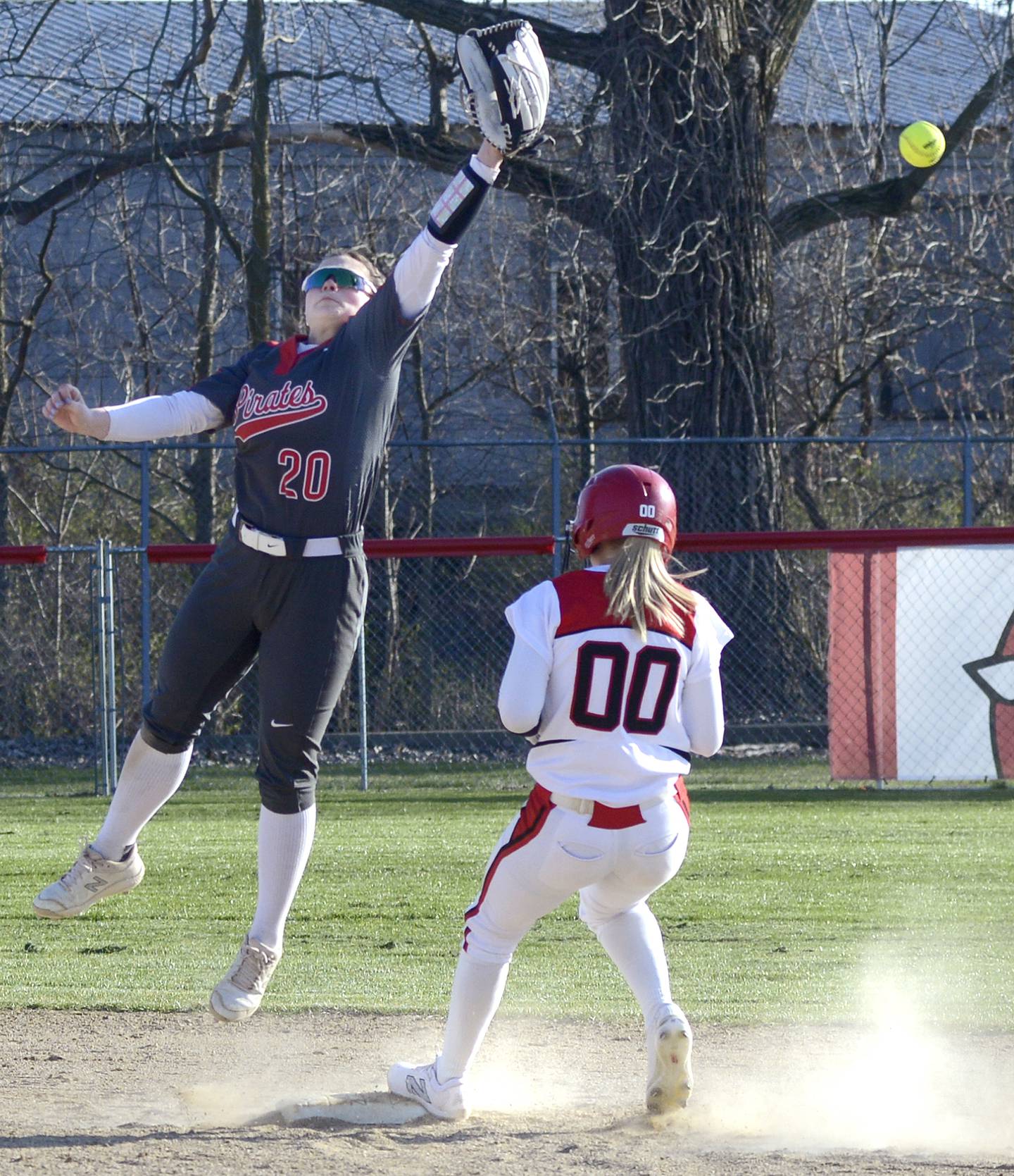 Kendall Lowery reaches for a high throw as Ottawa’s Lily Kupec gets into second base safely on a stolen base in the 2nd inning Tuesday at Streator.