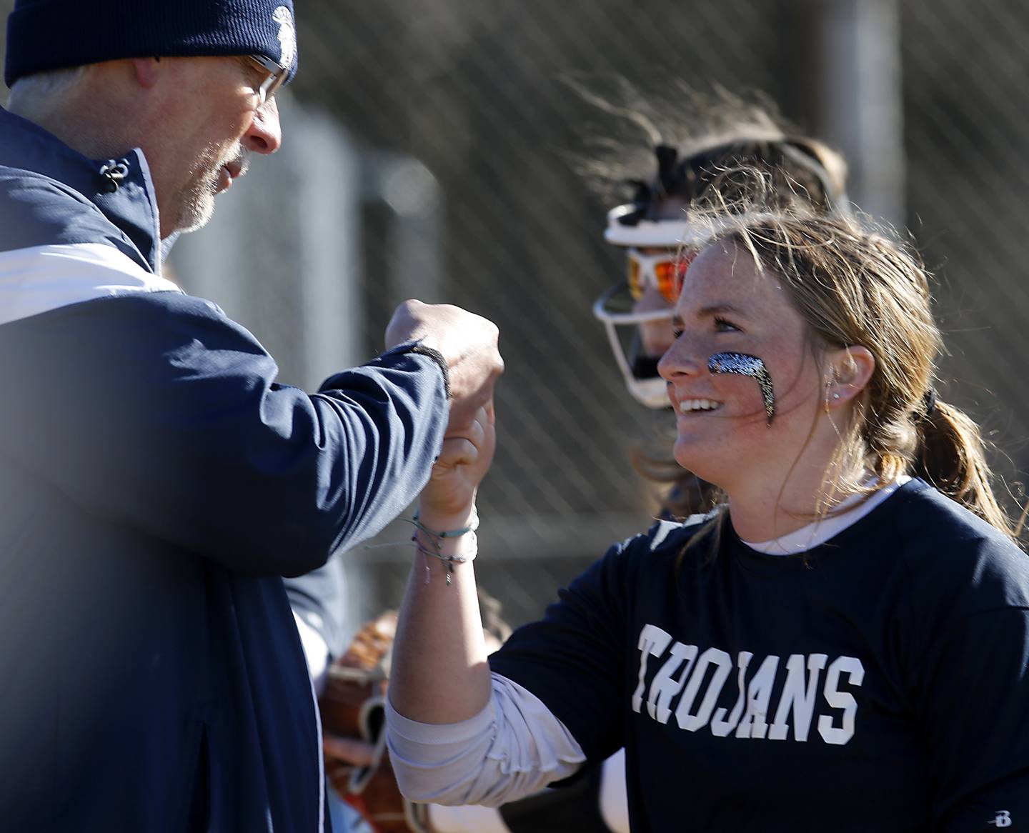 Cary-Grove’s Rebecca Weaver receives a high five from assistant coach Mark Olson after she made a catch during a Fox Valley Conference softball game against Crystal Lake Central Thursday, April 6, 2023, at Crystal Lake Central High School.