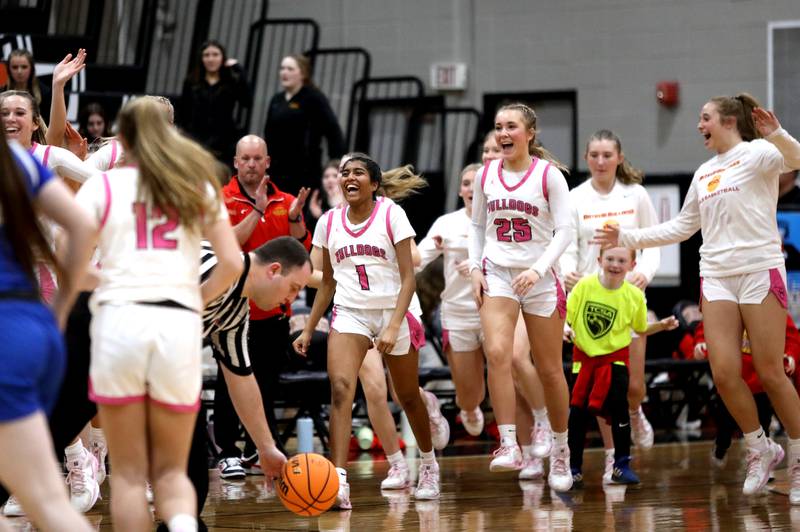 Batavia players celebrate their win over Wheaton North in a Class 4A St. Charles East Sectional semifinal on Tuesday, Feb. 25, 2025 in St. Charles.
