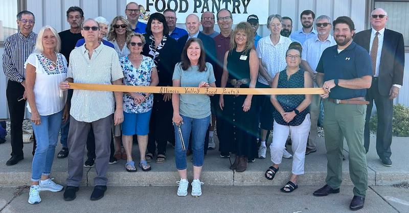 The Illinois Valley Food Pantry celebrating its new location opening with a ribbon-cutting