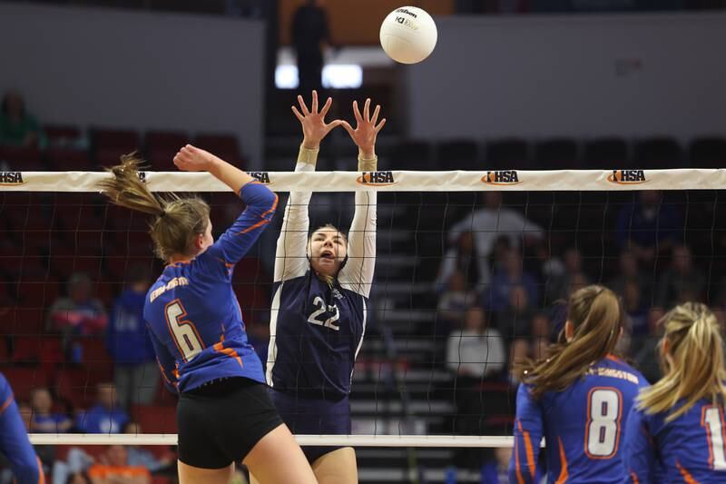 IC Catholic’s Jenny Fromelt goes for the block against Genoa-Kingston in the Class 2A championship match on Saturday in Normal.