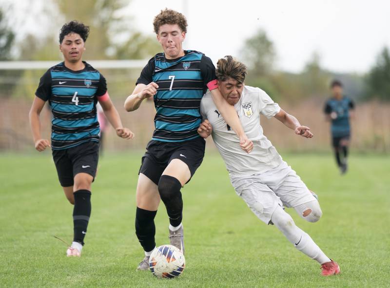 Woodstock North's Cole Morrison, left, and Harvard's Bryan Gorostieta collide during the Kishwaukee River Conference Tournament Championship game on Monday, October 6, 2025 at Woodstock North High School. Ryan Rayburn for Shaw Local
