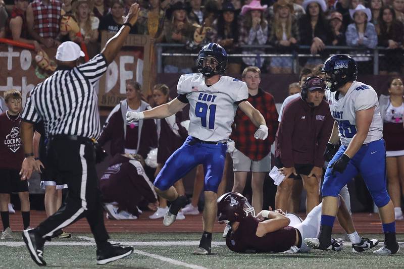 Lincoln-Way East’s Caden O’Rourke celebrates a sack forcing a fourth down for Lockport on Friday, Sept. 29, 2023 in Lockport.